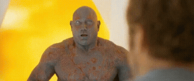 Man With Chest Tattoo Standing Next To Another Man GIF