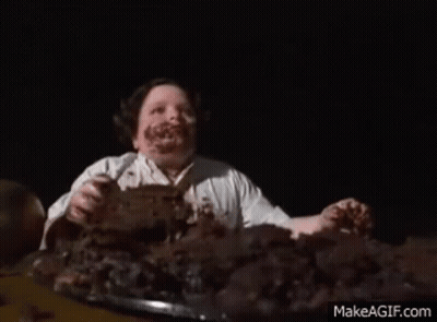 Man With Chocolate Face Eating Cake GIF
