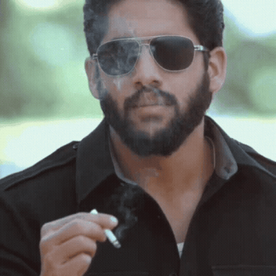 Man With Cigar In Brown Jacket GIF