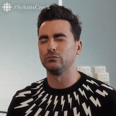 Man With Closed Eyes In Black And White Lightning Sweater GIF