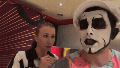 Man With Clown Face Next To Woman GIF