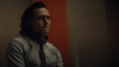 Man With Collar In Front Of Good Riddance Sign GIF