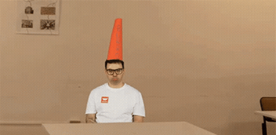 Man With Cone Pointing To Burro GIF