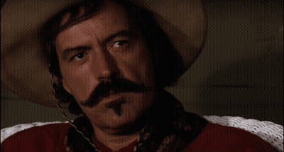 Man With Cowboy Hat And Mustache Says Bye GIF