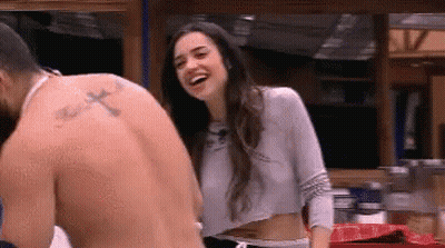 Man With Cross Tattoo Standing Next To Laughing Woman GIF