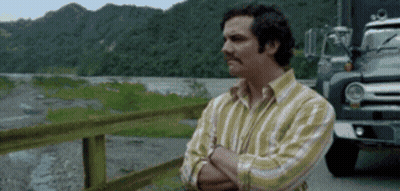 Man With Crossed Arms Next To Truck GIF
