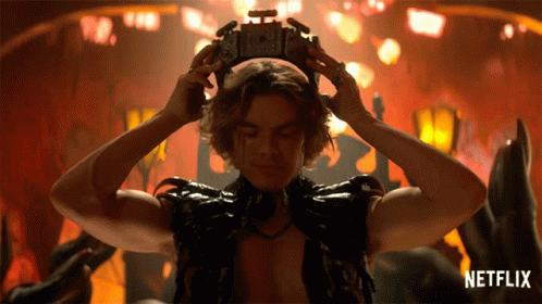 Man With Crown And Netflix Logo Behind Him GIF