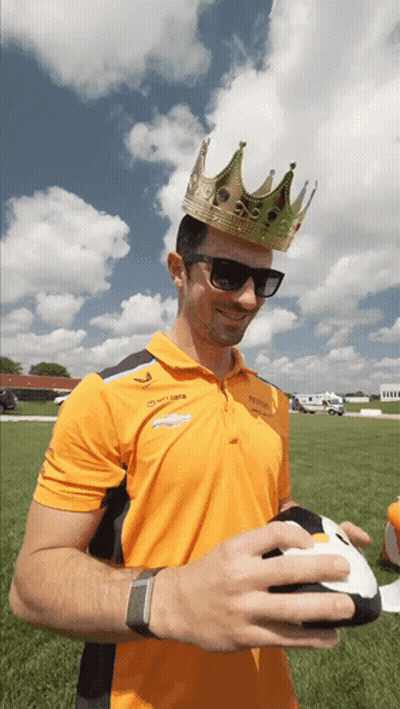 Man With Crown And Sunglasses Holding Football GIF