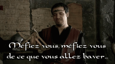 Man With Crown Holding Catapult Says Mefiez Vous GIF