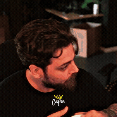 Man With Crown On Wrist Wearing Capon T-Shirt GIF