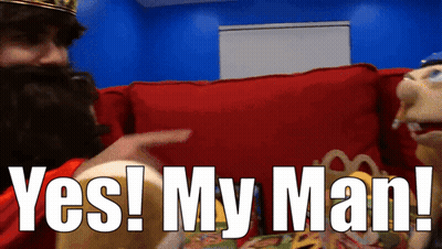Man With Crown Sitting On Red Couch GIF