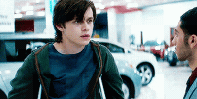 Man With Crutches Talking To Man In Car Showroom GIF