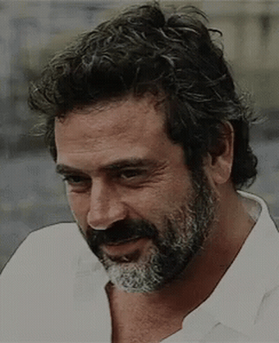 Man With Curly Hair And Beard In White Shirt GIF