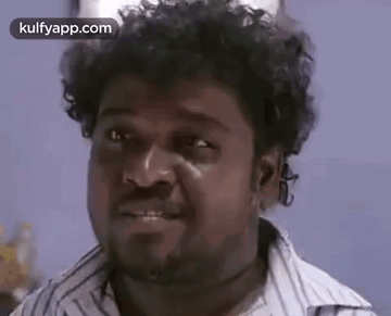 Man With Curly Hair And Beard Making Funny Face Smiling GIF