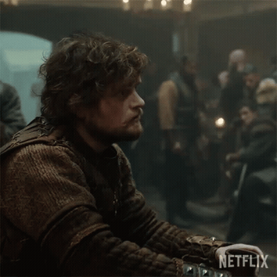 Man With Curly Hair And Beard Netflix Logo Dark Room GIF
