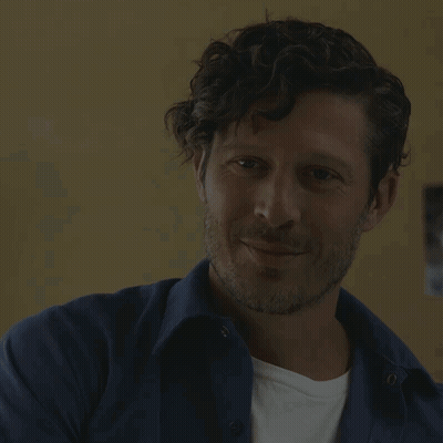 Man With Curly Hair And Beard Smiling GIF