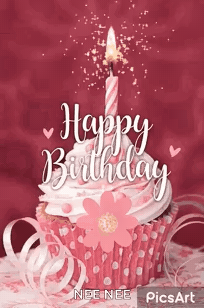 Man With Curly Hair And Beard Smiling In Front Of Candles GIF