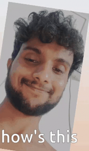 Man With Curly Hair And Beard Smiling GIF