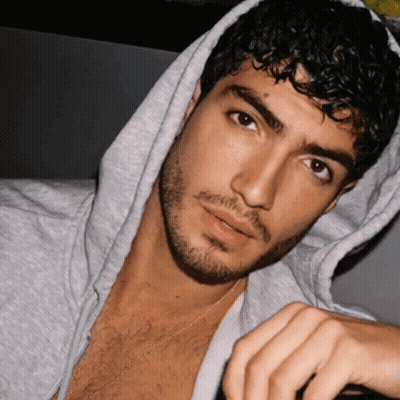 Man With Curly Hair And Beard Wearing Hoodie GIF