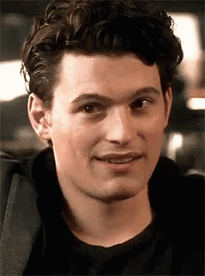 Man With Curly Hair And Black Shirt Smiling GIF