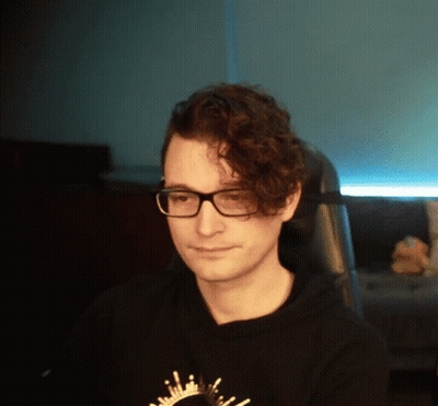Man With Curly Hair And Glasses In Black Shirt GIF