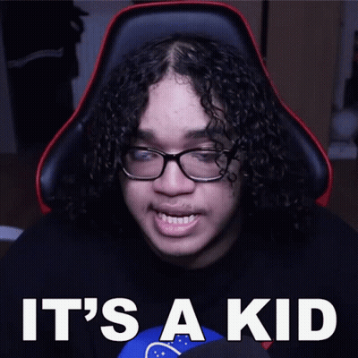 Man With Curly Hair And Glasses Sitting GIF