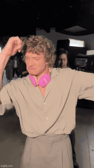 Man With Curly Hair And Pink Headphones GIF