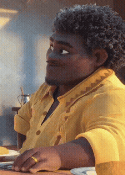 Man With Curly Hair And Yellow Shirt Sitting GIF