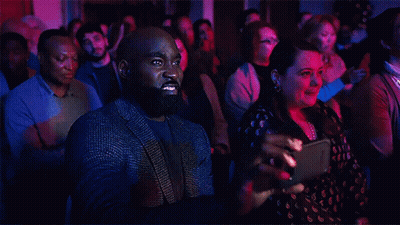 Man With Curly Hair At NBC Microphone GIF