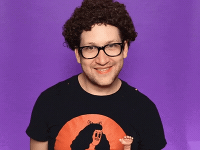Man With Curly Hair, Glasses, Woman Picture Shirt GIF