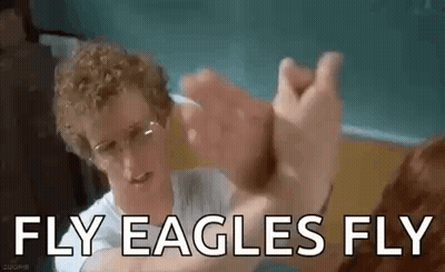 Man With Curly Hair High-Fiving Glasses Man GIF