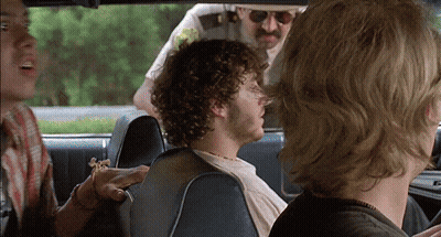 Man With Curly Hair In Back Seat GIF