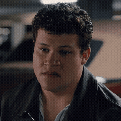 Man With Curly Hair In Black Jacket GIF