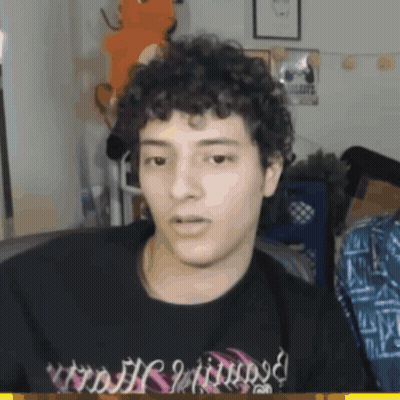 Man With Curly Hair In Black Shirt Saying Nightmare GIF