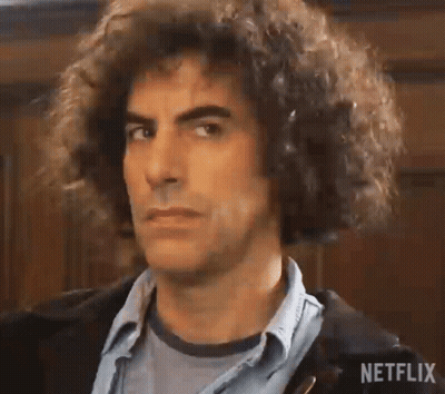 Man With Curly Hair In Denim Shirt And Jacket GIF