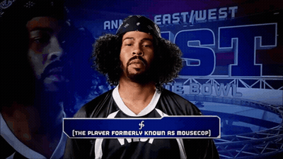 Man With Curly Hair In Front Of East West Bowl Sign GIF