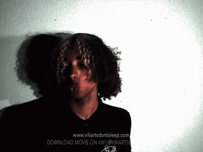 Man With Curly Hair In Front Of Website GIF