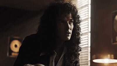 Man With Curly Hair In Front Of Window GIF