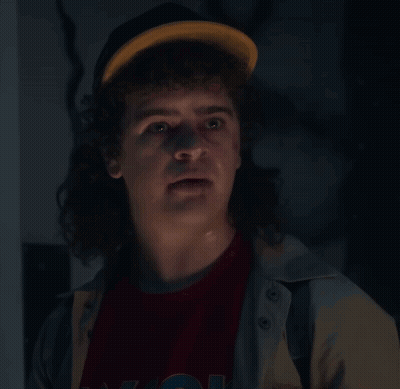 Man With Curly Hair In Hat And N.Y.C. T-Shirt GIF
