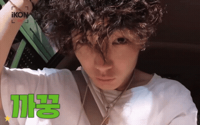 Man With Curly Hair In White Shirt Saying Ikon GIF