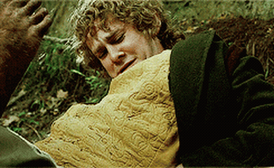 Man With Curly Hair Laying On Ground With Blanket On Chest GIF