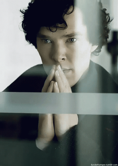 Man With Curly Hair Looking Out Window Hands Folded GIF