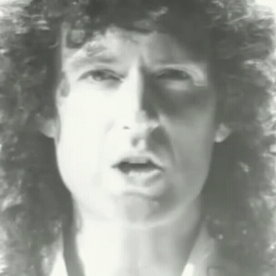 Man With Curly Hair Making A Face GIF