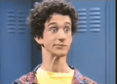 Man With Curly Hair Making Funny Face At Locker GIF