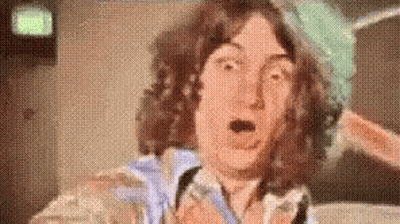 Man With Curly Hair Making Funny Face GIF