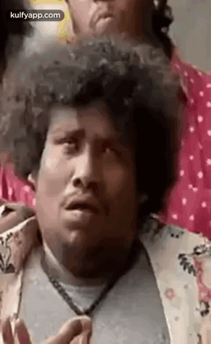Man With Curly Hair Making Funny Face Next To Another Man GIF