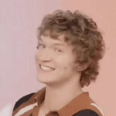 Man With Curly Hair Making Funny Face GIF