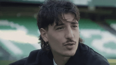 Man With Curly Hair Mustache And Earrings GIF