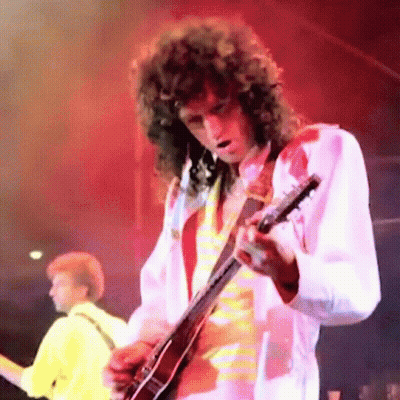 Man With Curly Hair Playing Guitar GIF