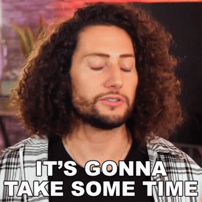 Man With Curly Hair Saying It Will Take Time GIF